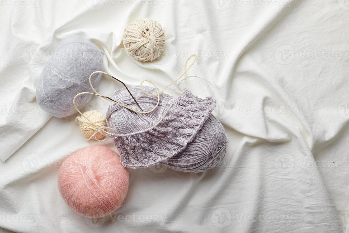 Balls of wool and mohair for knitting in pastel colors photo