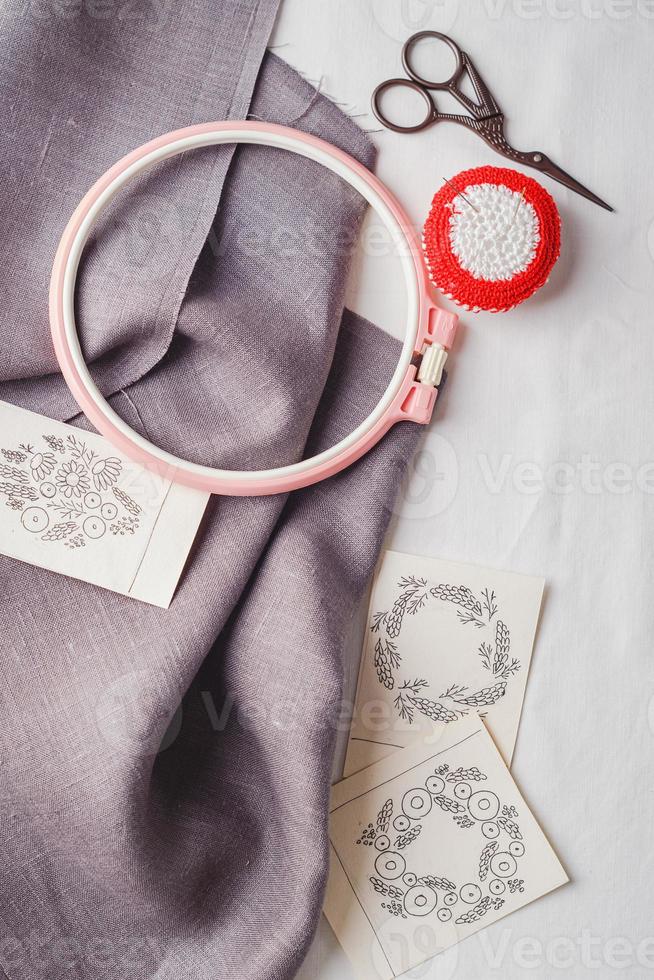 Embroidery set. Linen fabric, embroidery patterns, embroidery hoop and needls. photo
