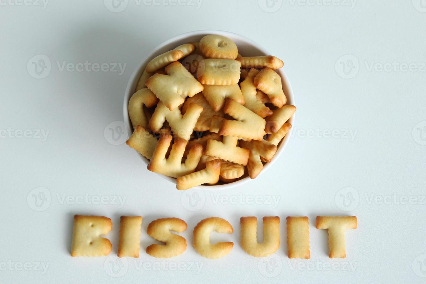 A bowl of cookies with inscription from the cookies on the white background. photo