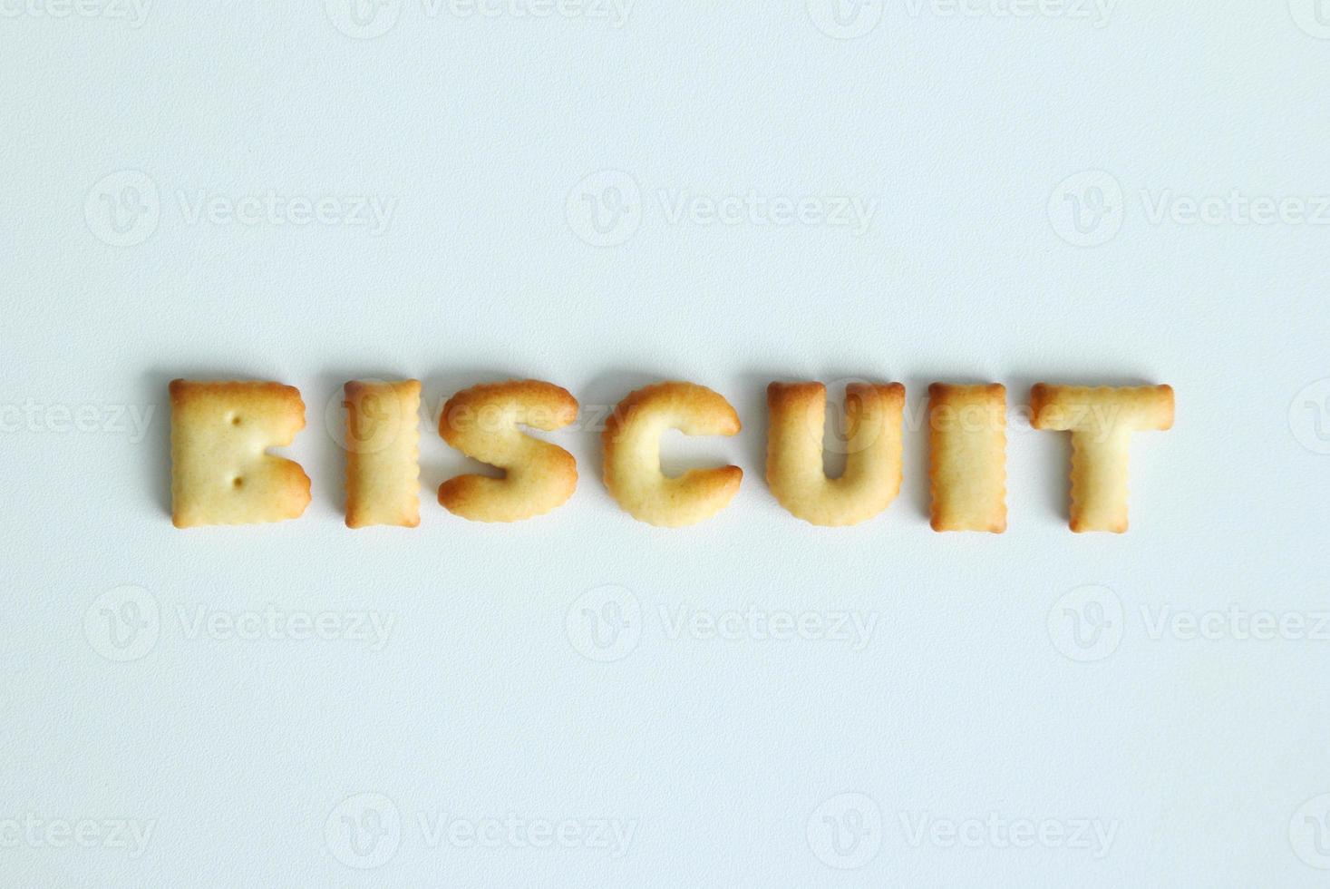 An inscription from the cookies on the white background. Text - biscuit. photo