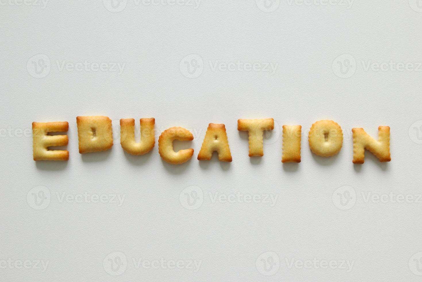 An inscription from the cookies on the white background. Text - education. photo