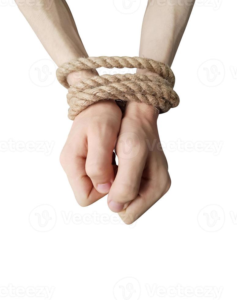 Teenager's hands tied with a rope isolated on white background photo