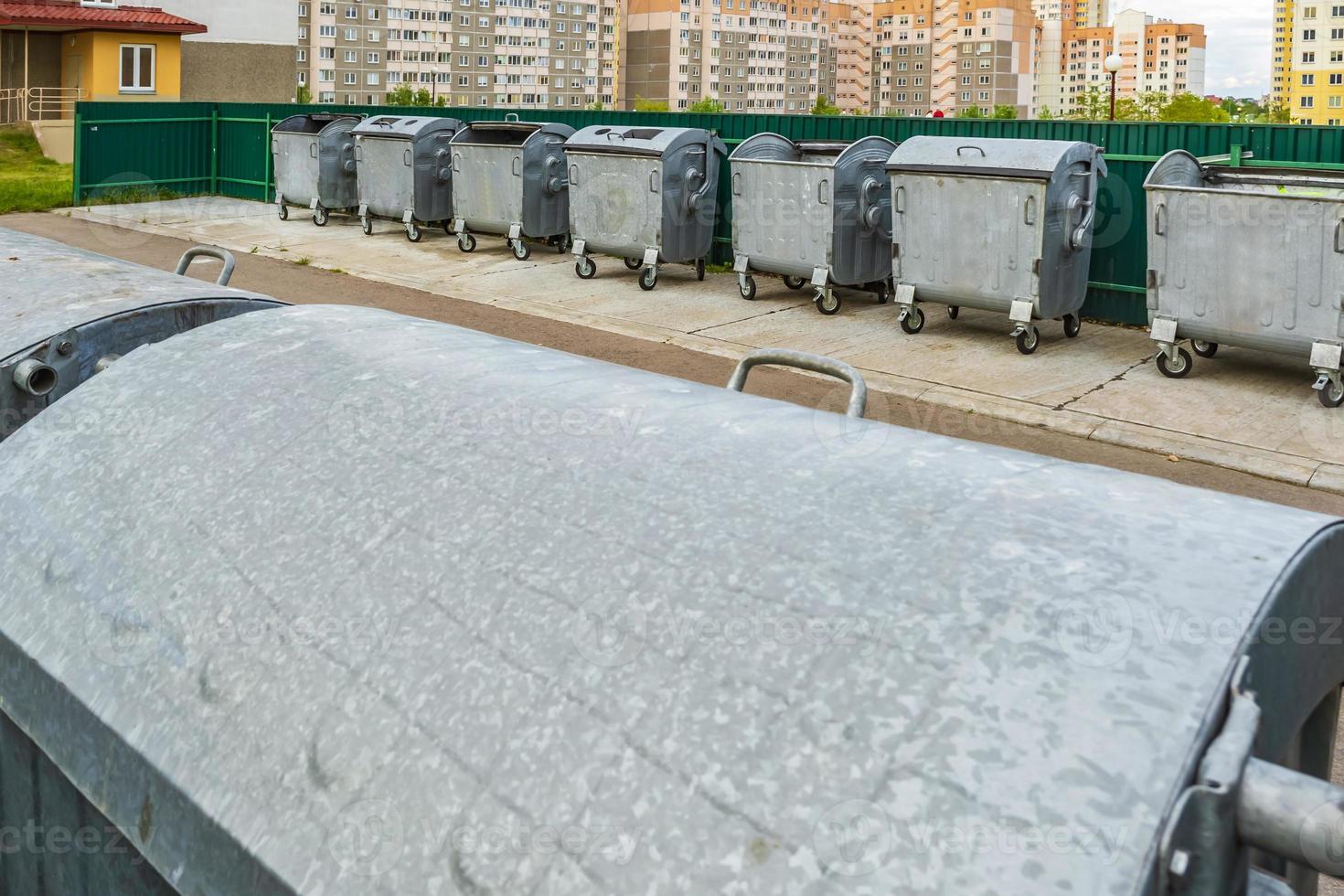 metal trash cans for separate waste collection in a densely populated area of the city photo
