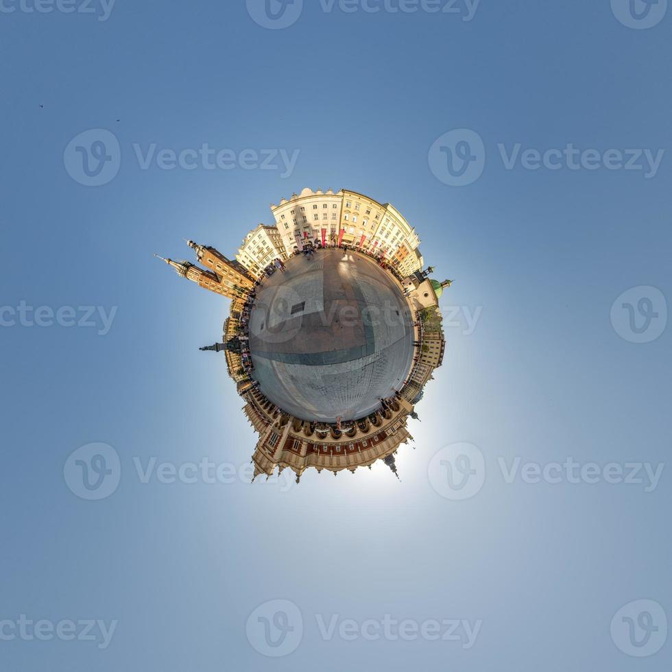 Little planet and spherical aerial 360 panorama view on street ancient medieval city with church and historic buildings photo