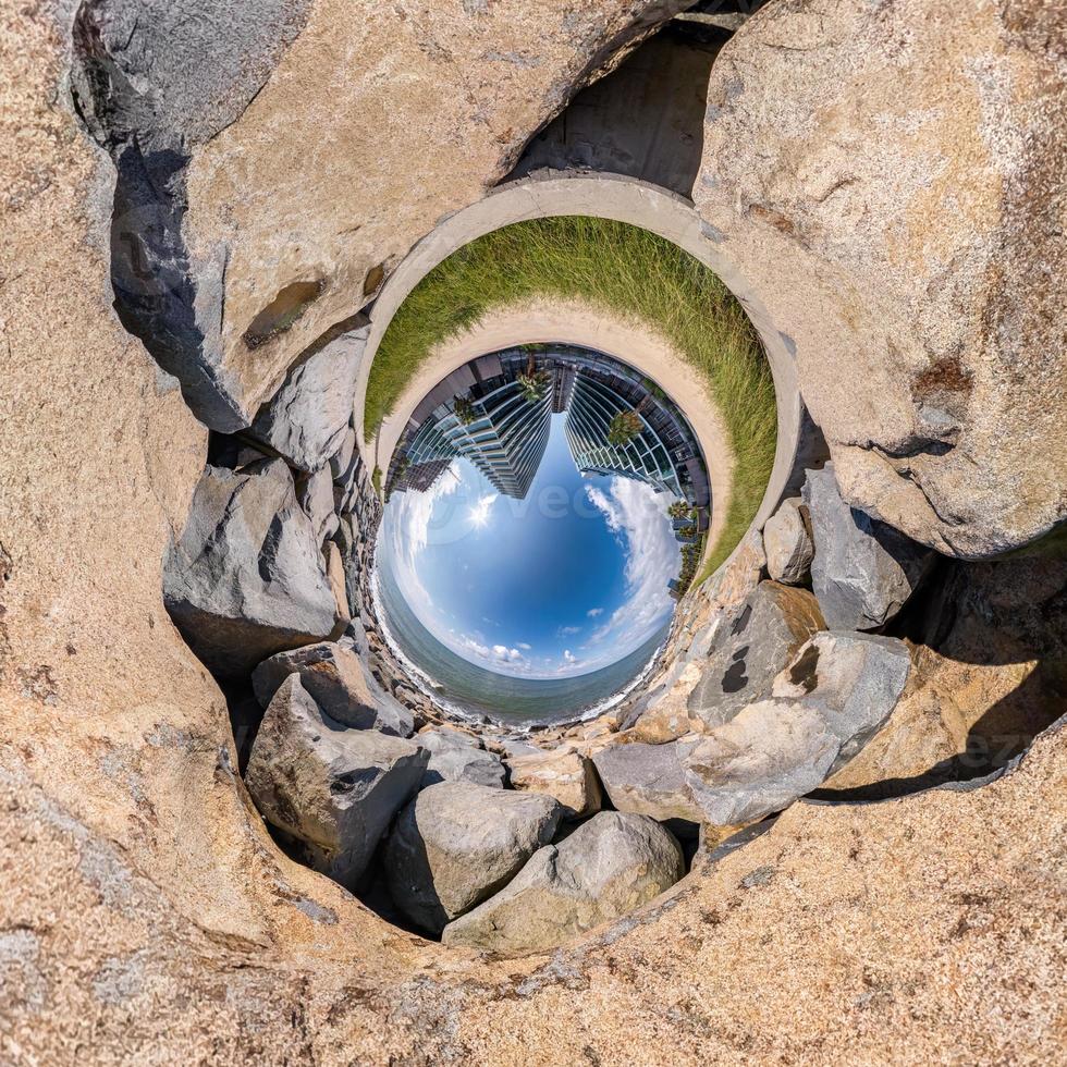 blue sphere little planet inside gravel road and pebbles. curvature of space photo