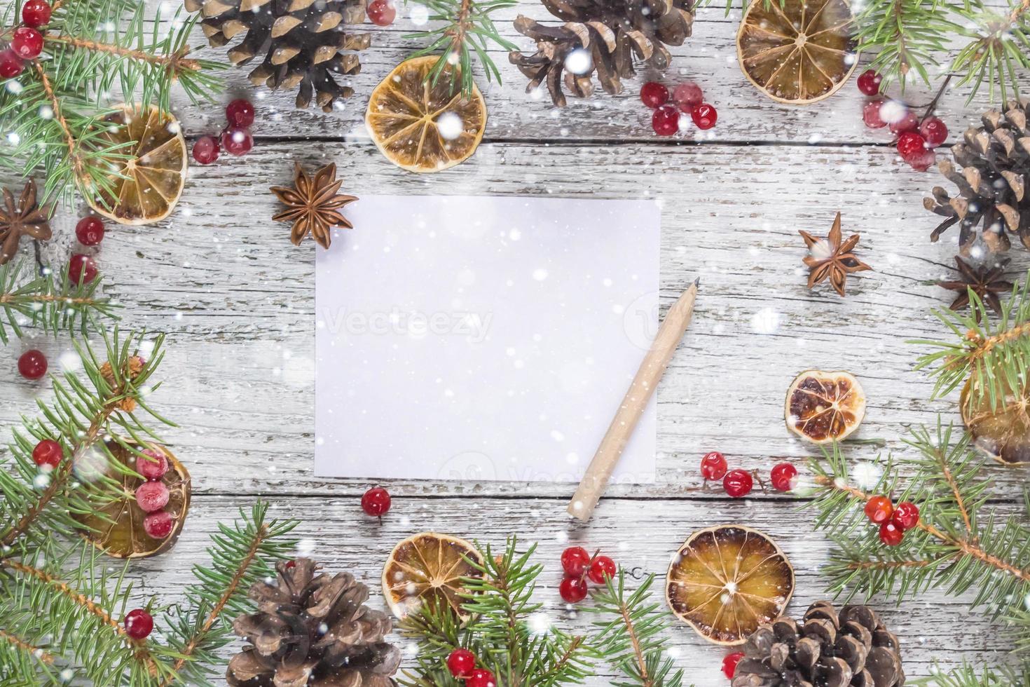 Christmas branches cones berries lemon with copy space photo