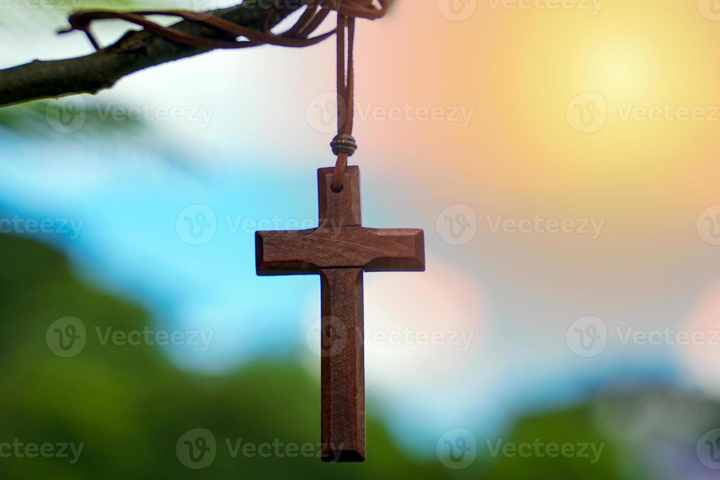 The cross is a symbol of Christianity. Which Christians often decorate the cross as a house worship. It is believed that the cross carries the power of rejuvenation. Soft and selective focus. photo