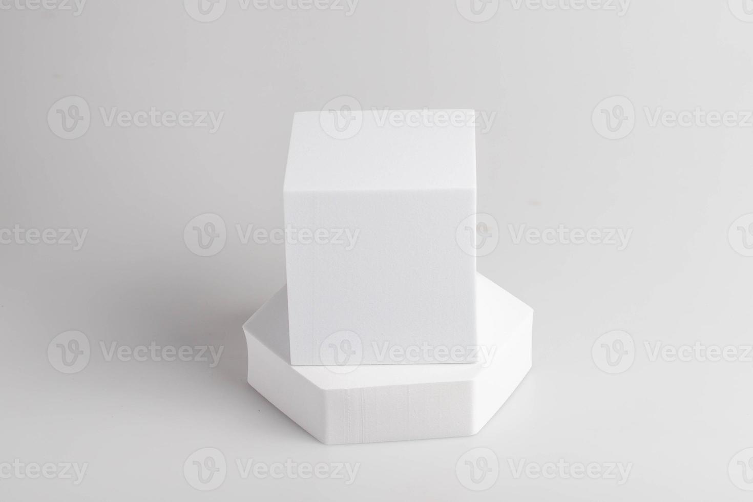 White product stand, mock up on a white background texture background Ideal backdrop for product presentations, exhibitions and mockups. photo