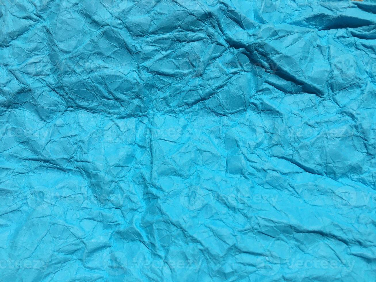 Modern blue crumpled paper texture background for Design. photo