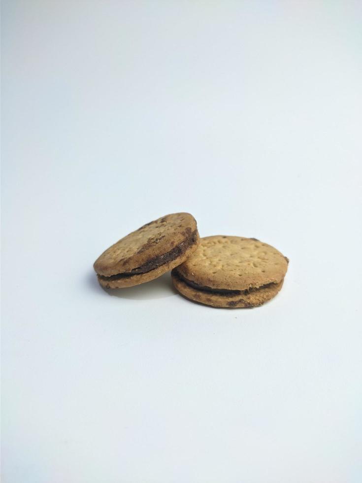 Sandwich biscuits, filled with chocolate, isolated on white background photo