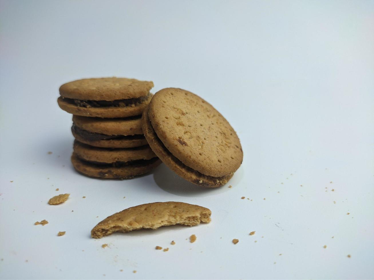 Sandwich biscuits, filled with chocolate, isolated on white background photo