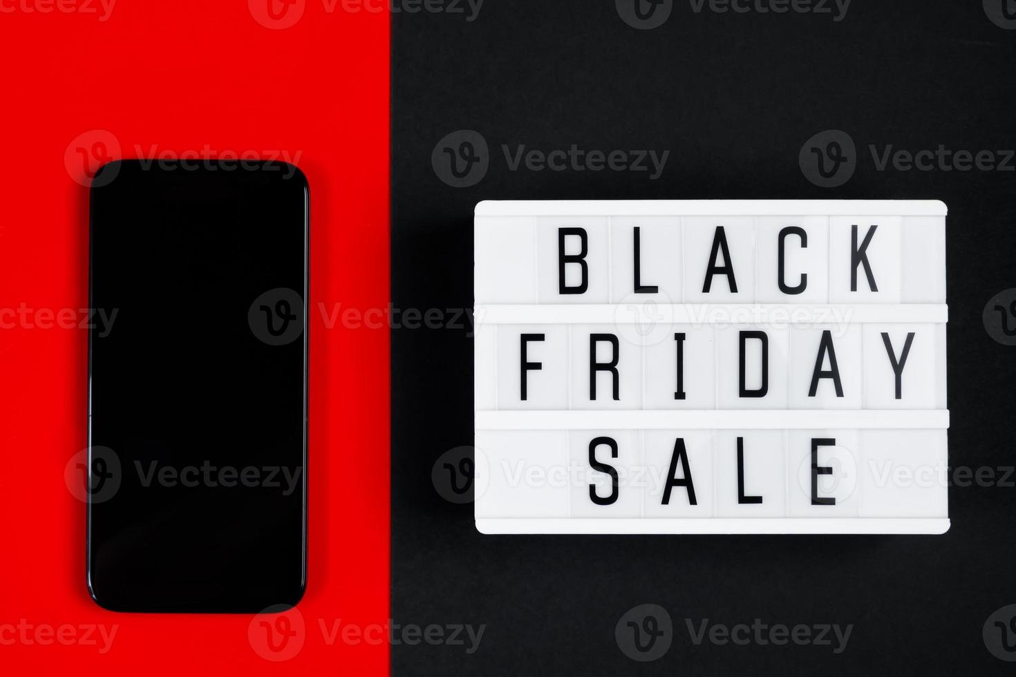 Black Friday online sale concept. Monochromatic flatlay on dark background. photo