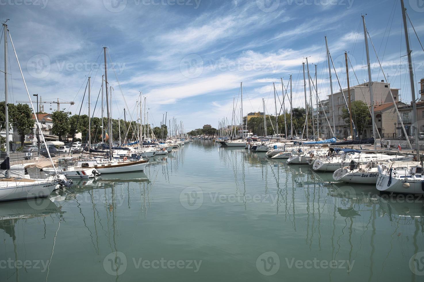 Boats moored along Rimini canal port photo