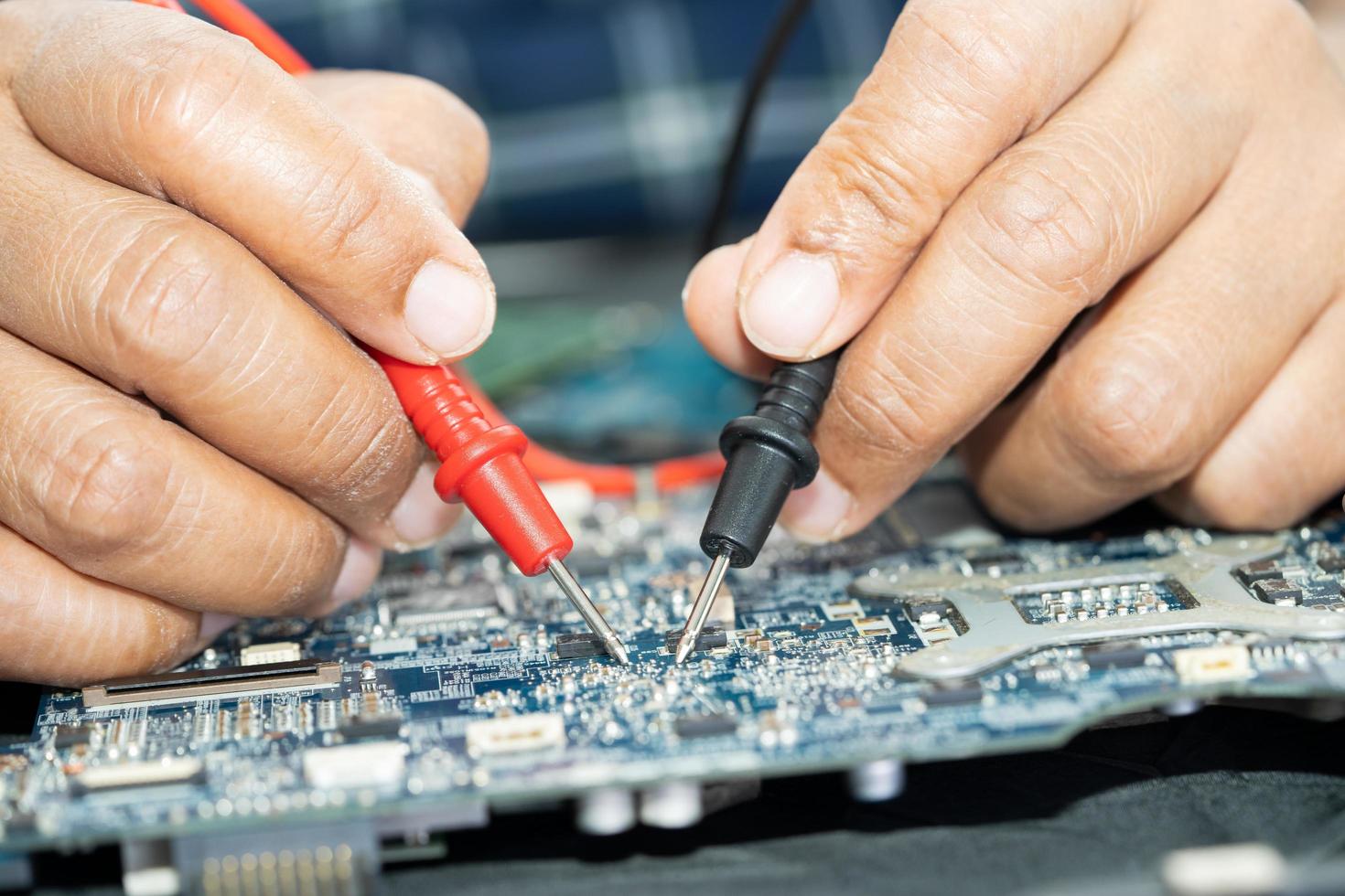 Technician repairing inside of mobile phone. Integrated Circuit. the concept of data, hardware, technology. photo