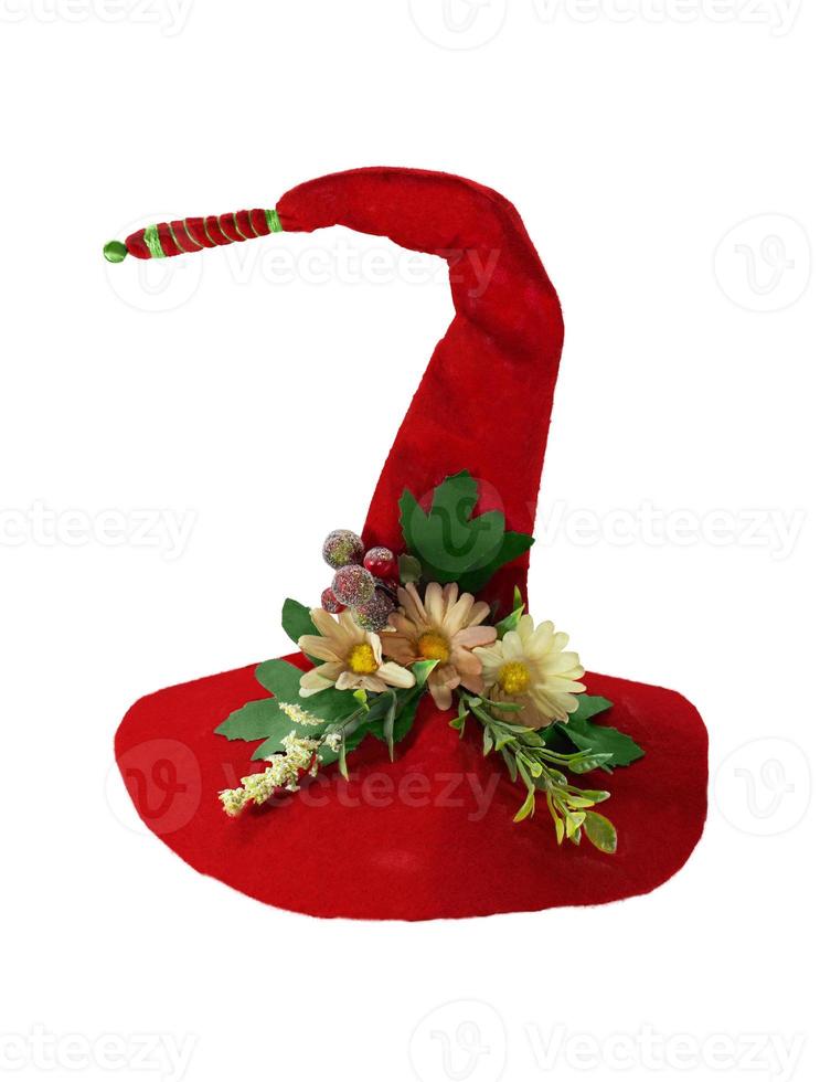 Felt red witch hat, headdress of Scandinavian gnome with beads, berries, flowers, leaves bent to the side. Halloween, christmas. Isolated white background photo