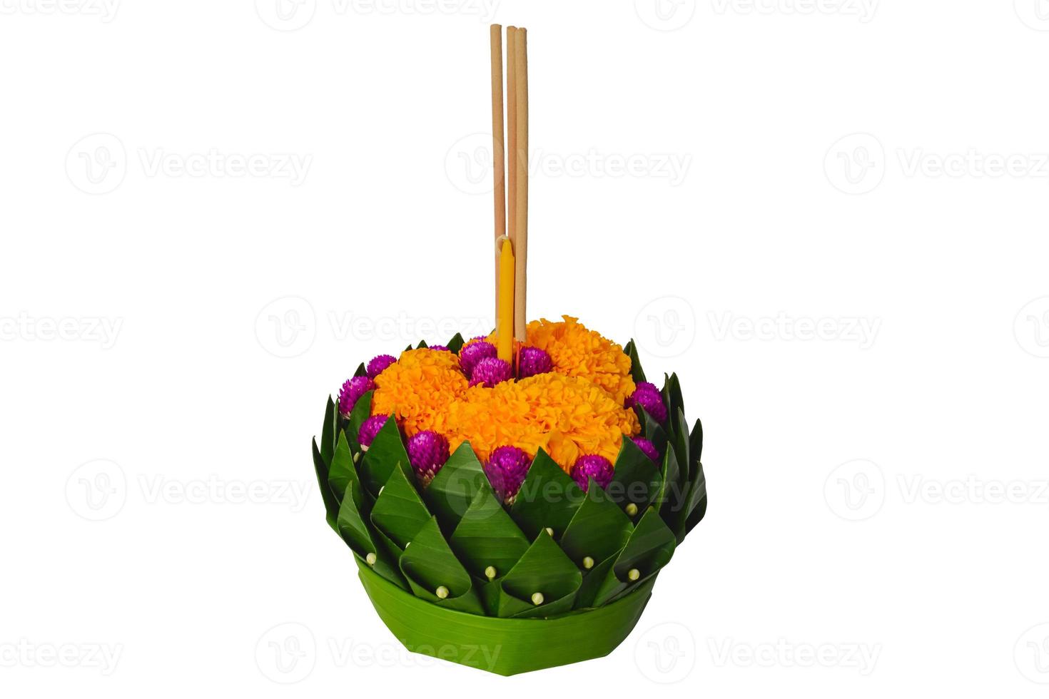 Banana leaf Krathong that have 3 incense sticks and candle decorates with flowers for Thailand full moon or Loy Krathong festival isolated on white background. photo