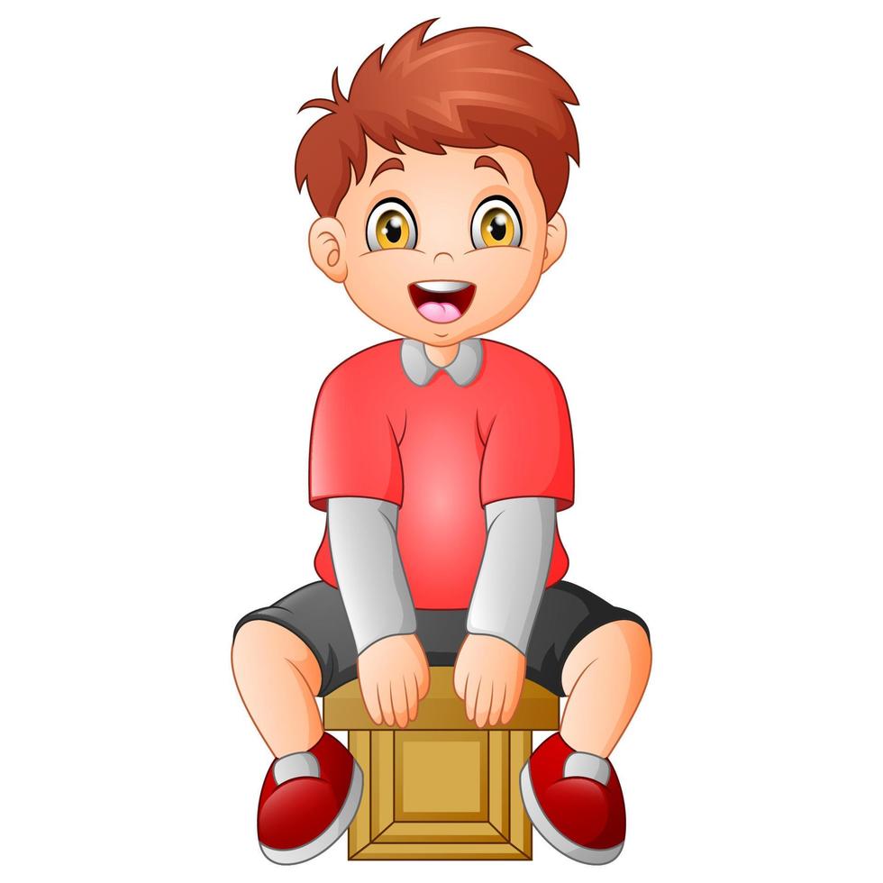 Cute little boy sitting on a cube vector