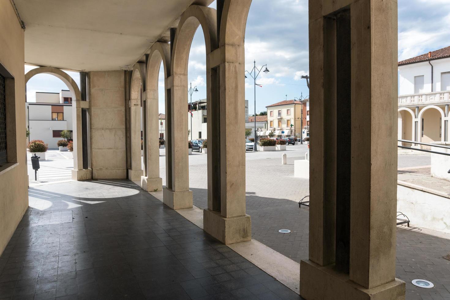 Tresigallo,Italy-may 2, 2021-detail of the porch in Tresigallo during a cloudy day photo