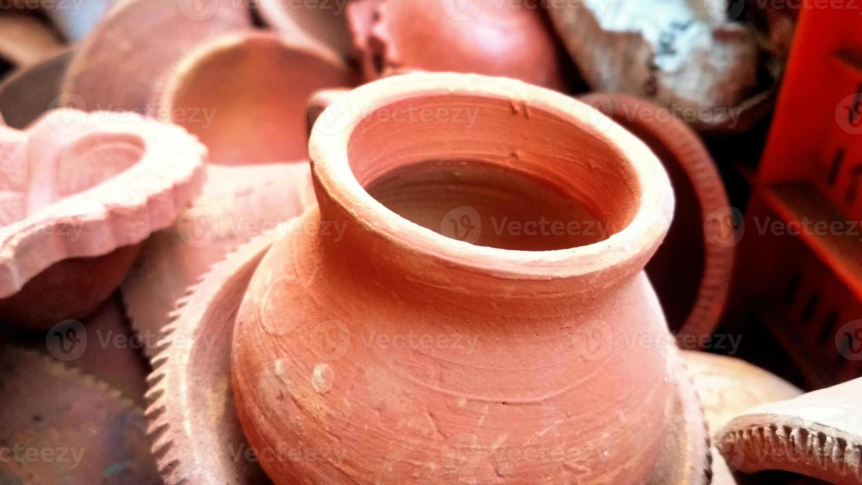 Close up of heap of Indian clay oil lanterns or diya ready to be sold in market during Diwali photo