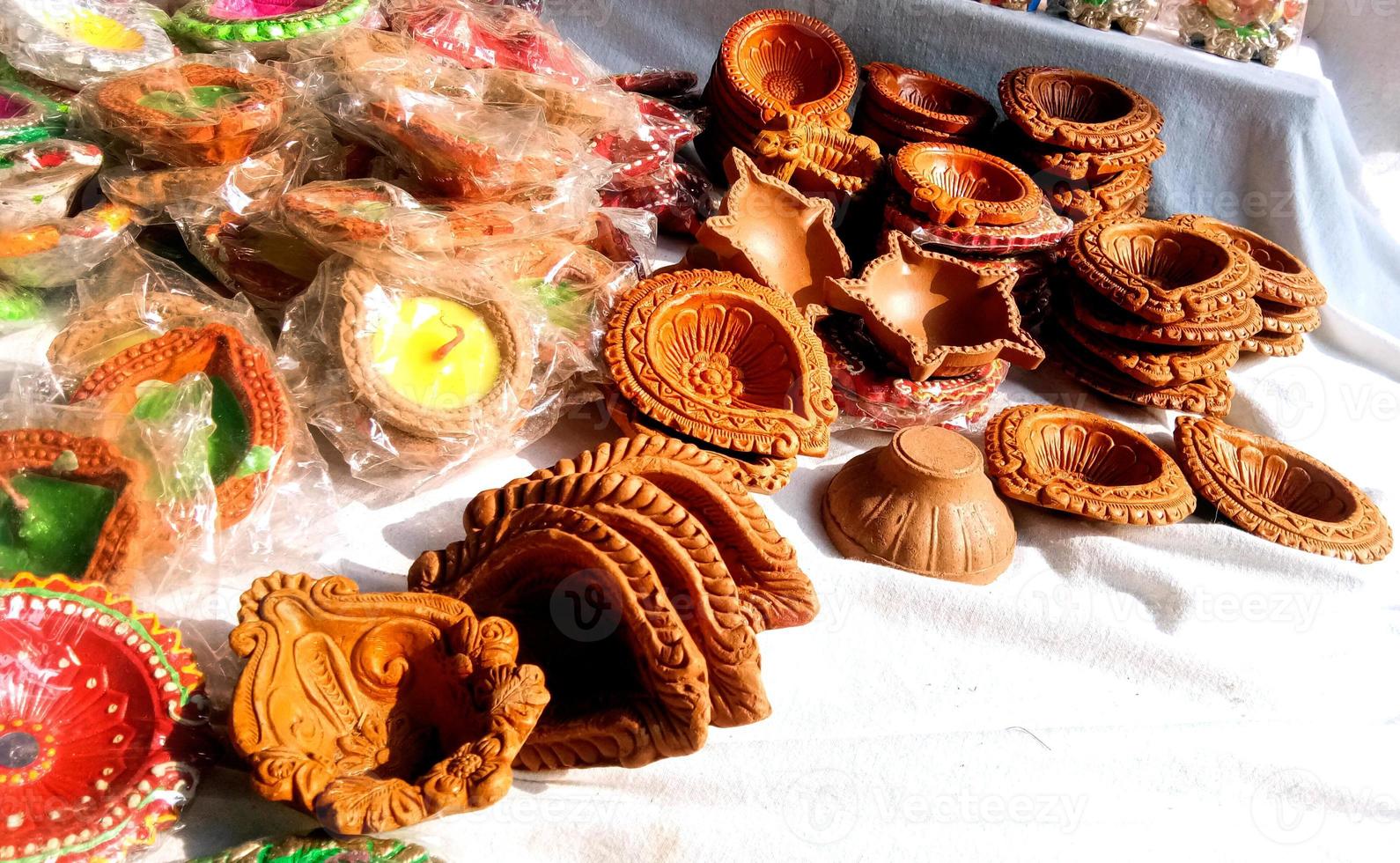 Close up of heap of Indian clay oil lanterns or diya ready to be sold in market during Diwali photo