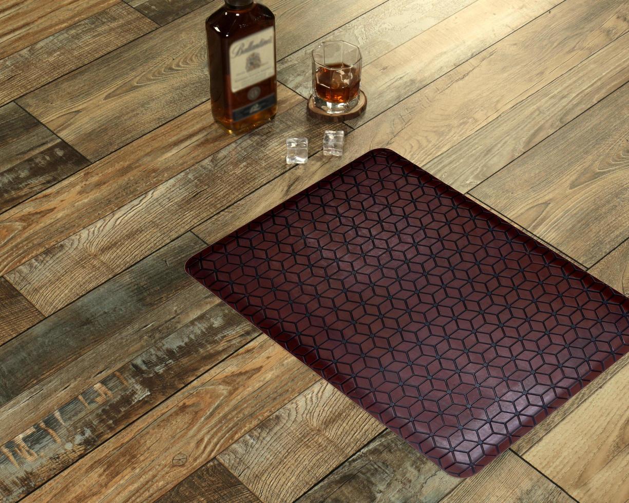 New Delhi, Delhi, IN, 2022 - Chocolate Black Leather textured welcome door mat placed with Whiskey and Glass photo