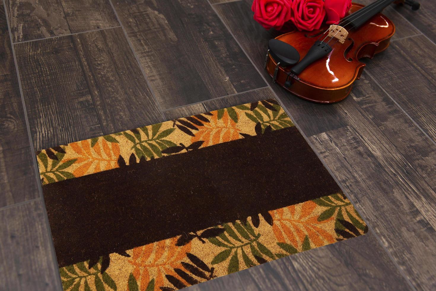 New Delhi, Delhi, IN, 2022 - Beautiful Colorful Leaf Printed Welcome zute doormat placed with Guitar and Red Roses photo