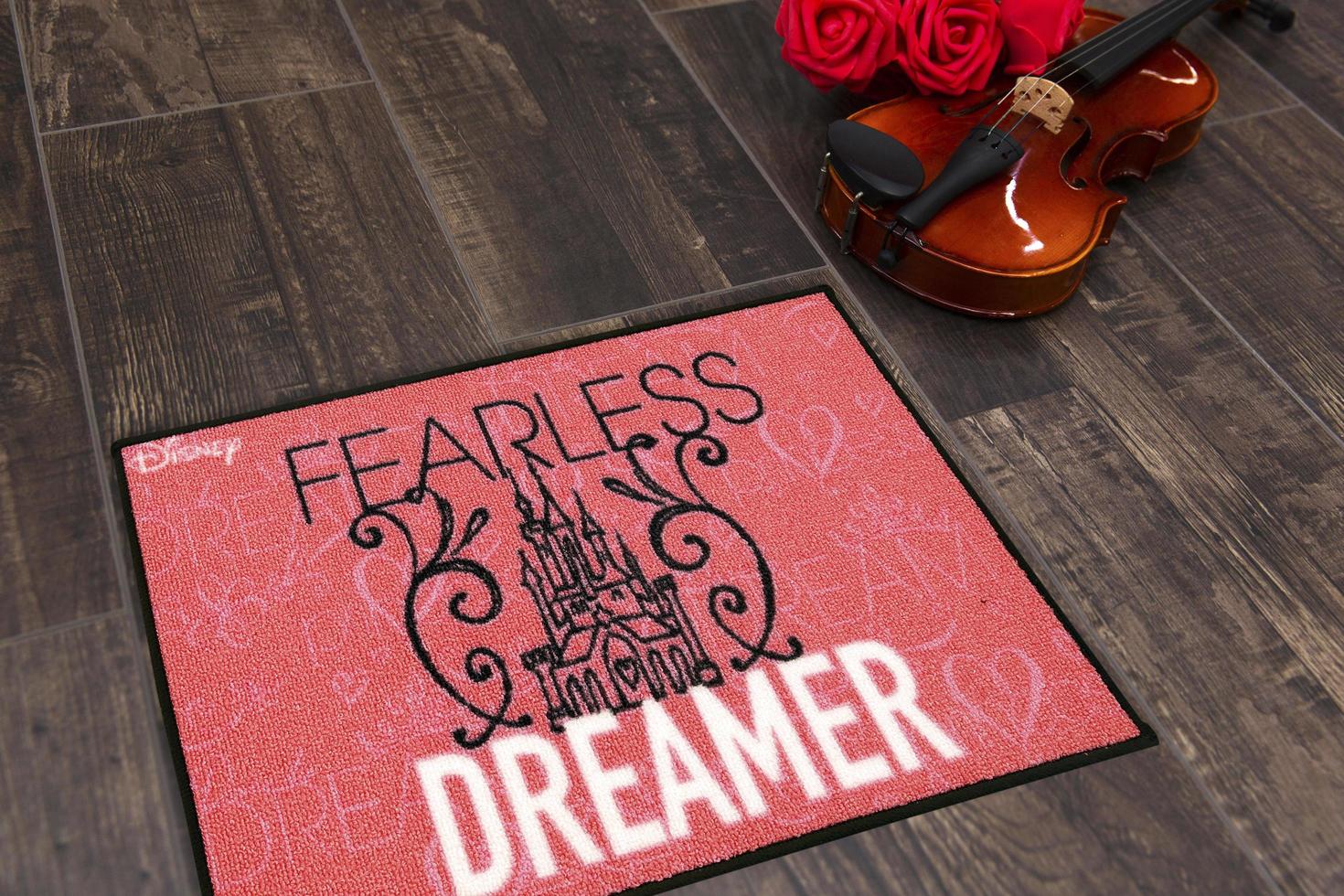 New Delhi, Delhi, IN, 2022 - Beautiful Fearless Dreamer Printed Kids Woolen Welcome Entry Doormat placed on brown floor with Guitar photo