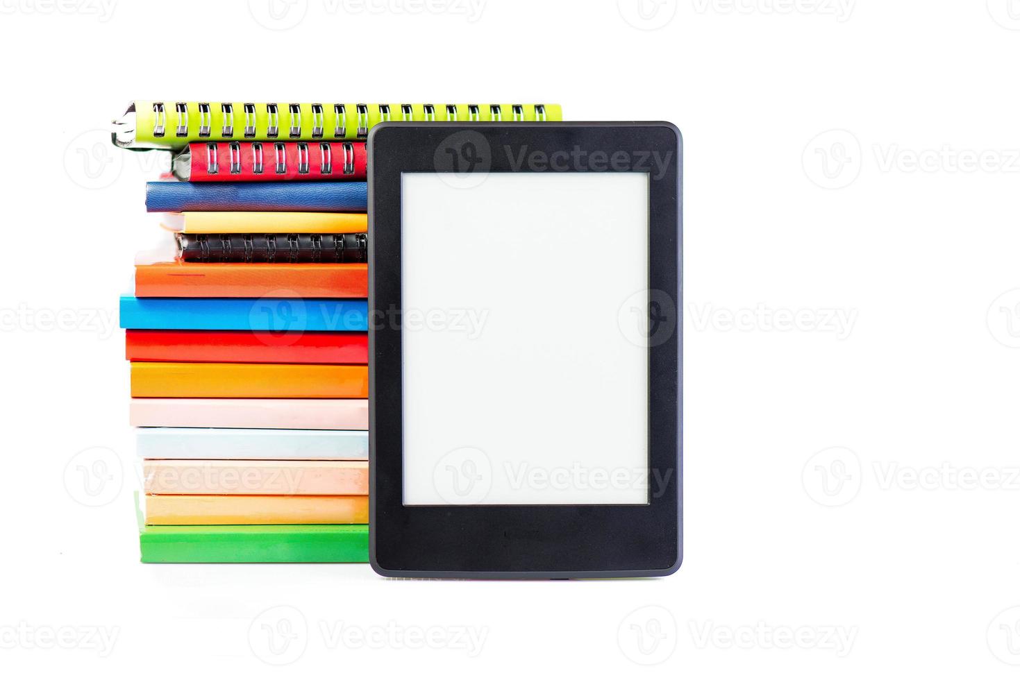 Ebook together with classic paper books and agendas concept of new technology photo