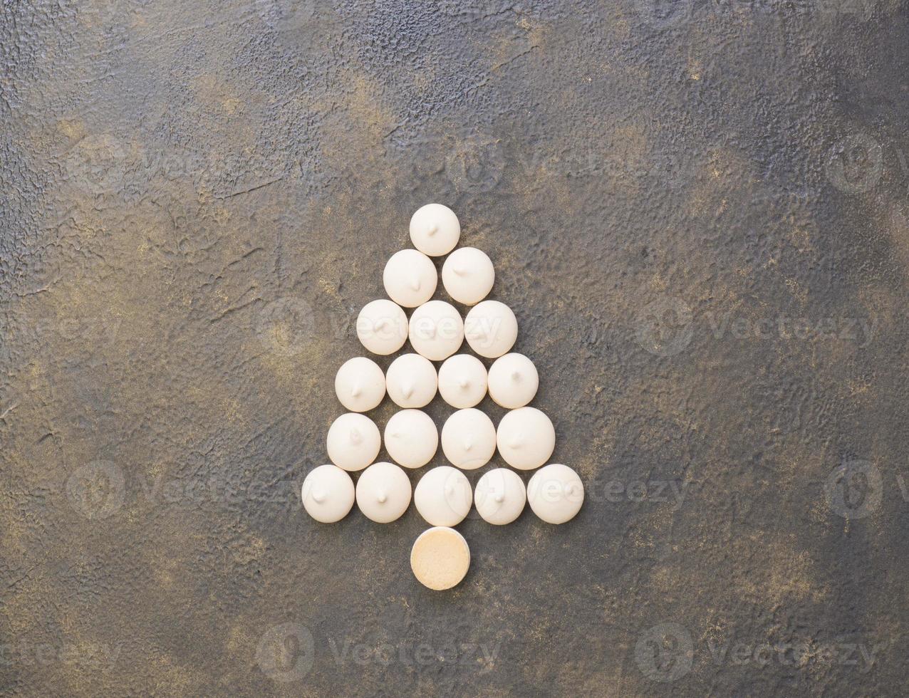 Christmas tree made from cookies on a black background. Christmas baking concept. photo