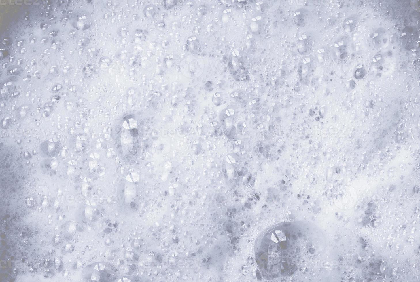 Abstract background soapy white foam and bubbles photo