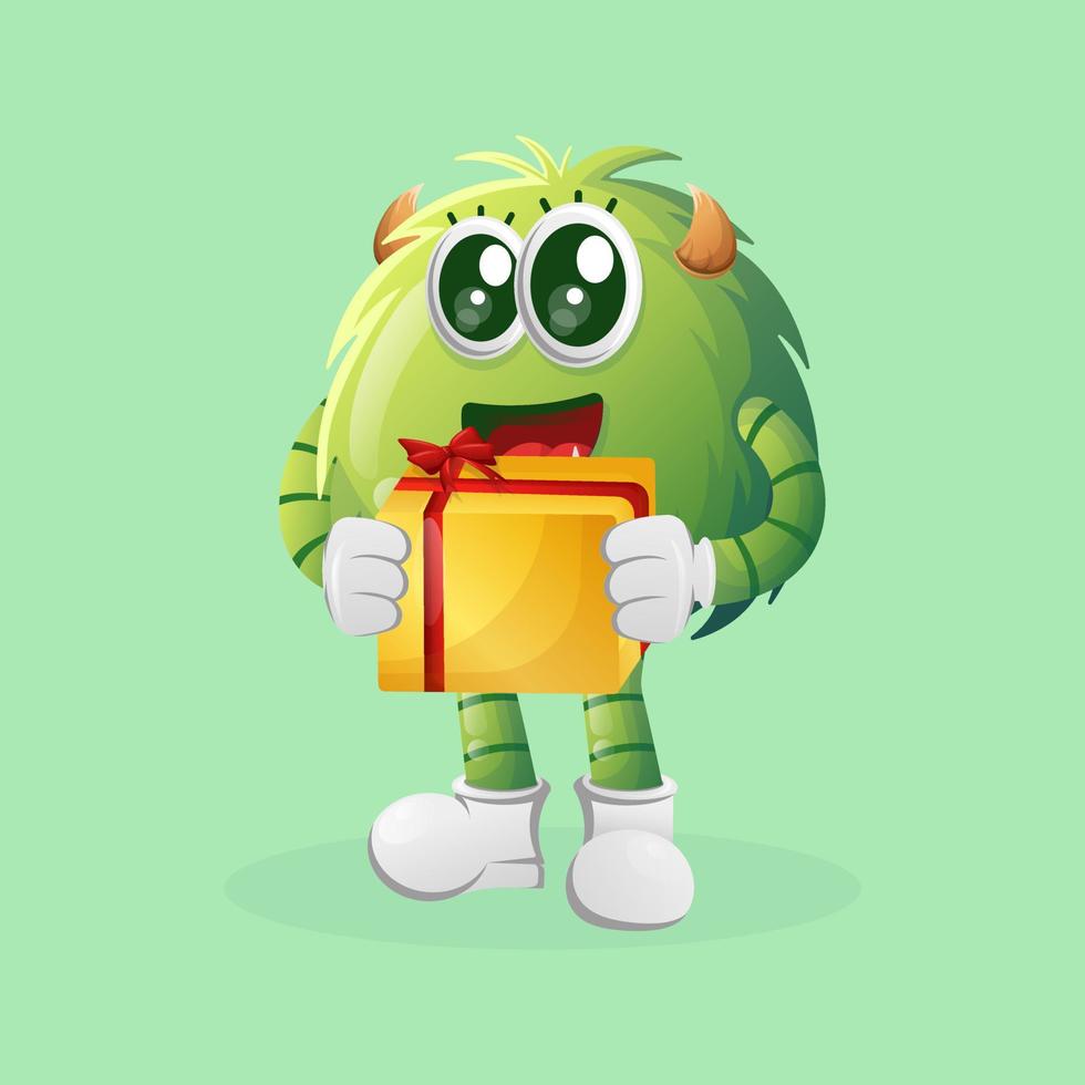 Cute green monster holding gift box vector