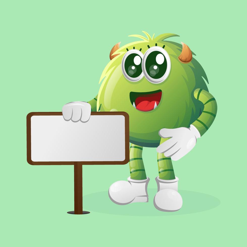 Cute green monster standing next to a billboard vector