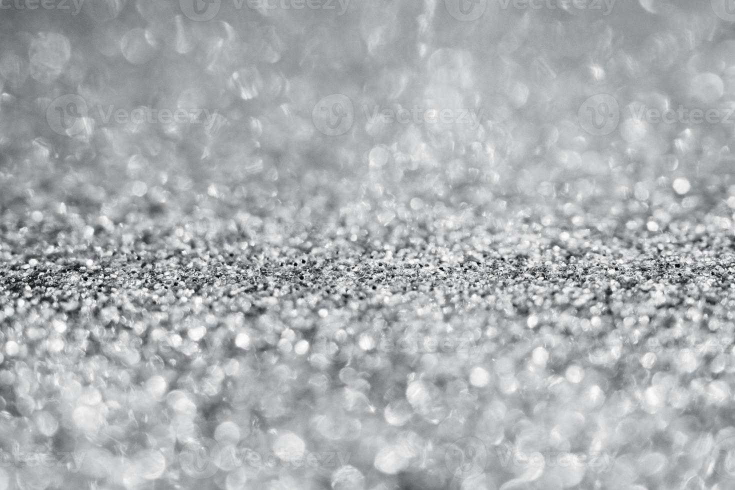 Abstract silver glitter sparkle texture with bokeh background photo