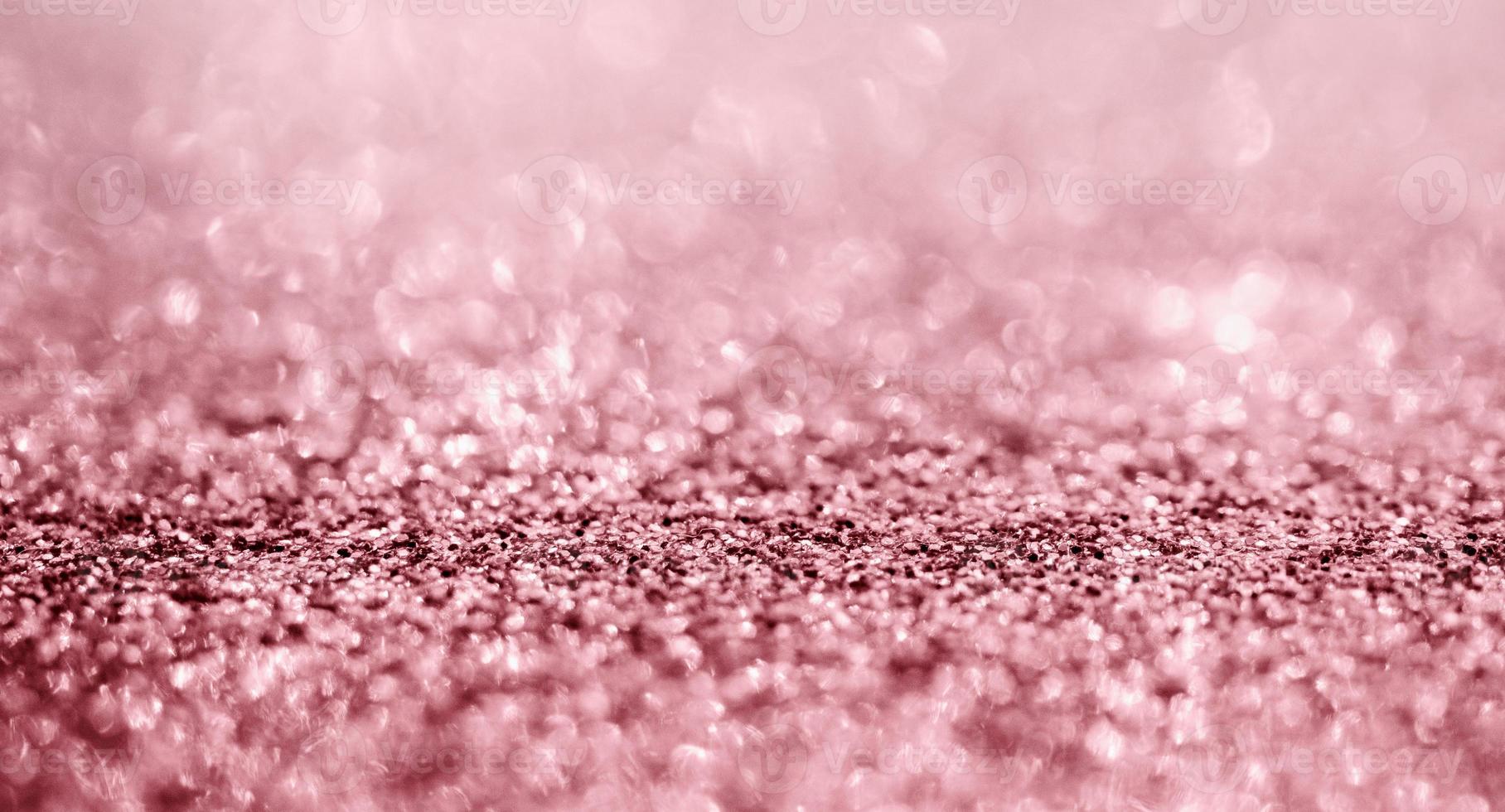 Abstract rose gold glitter sparkle texture with bokeh background photo