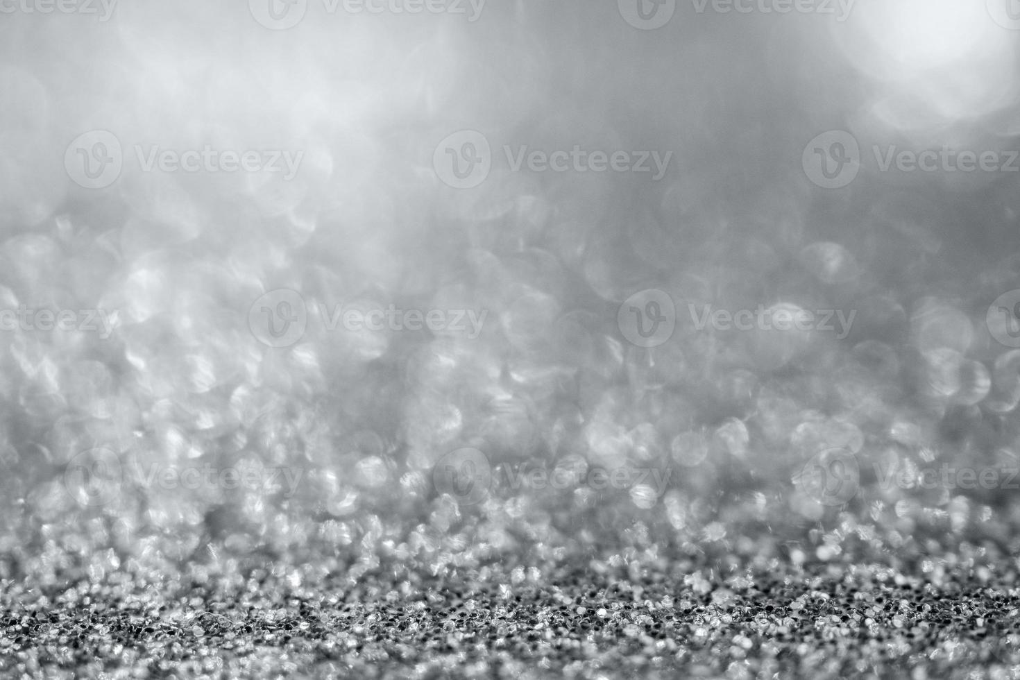 Abstract silver glitter sparkle texture with bokeh background photo