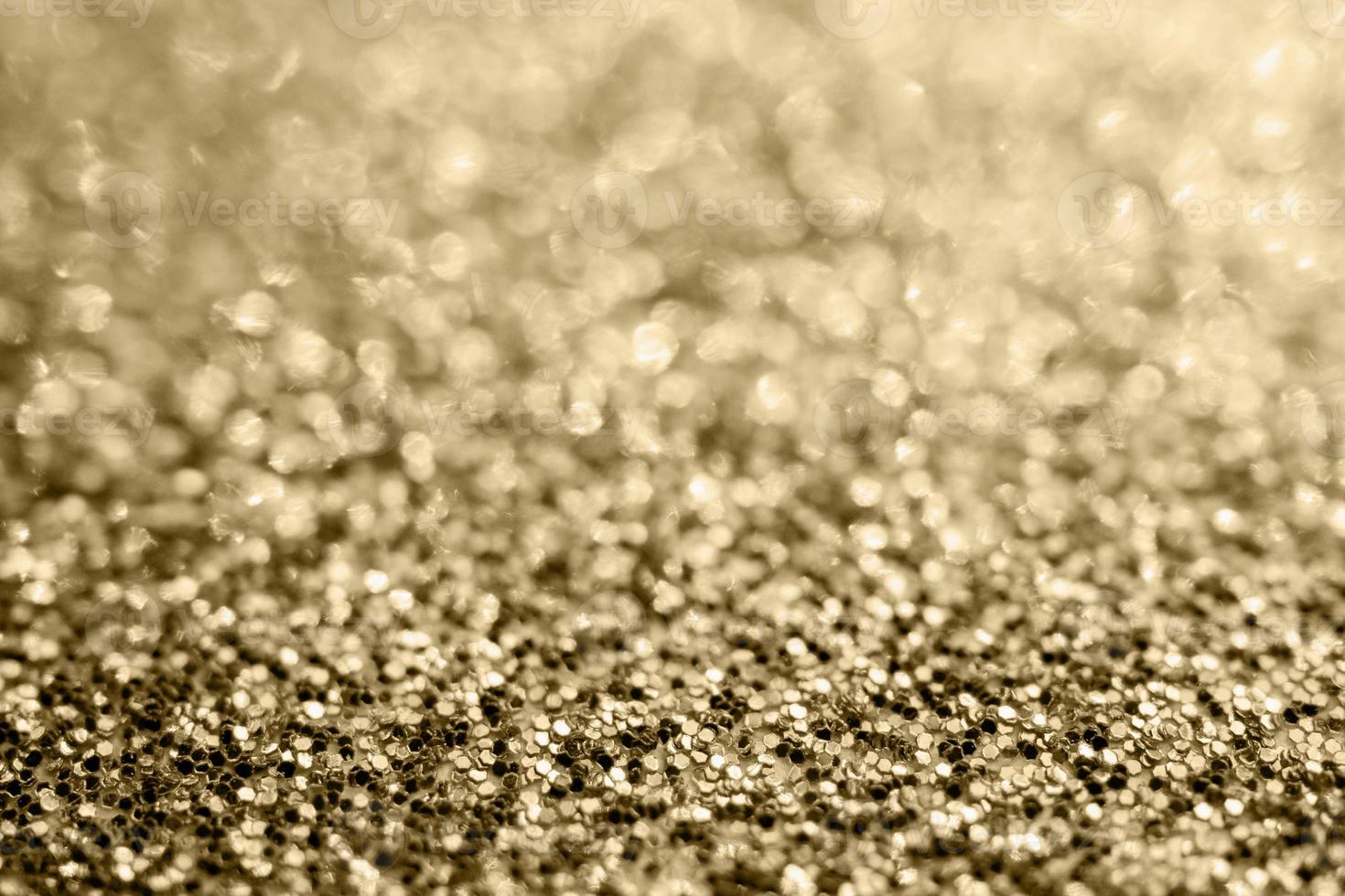 Abstract gold glitter sparkle blurred with bokeh background photo