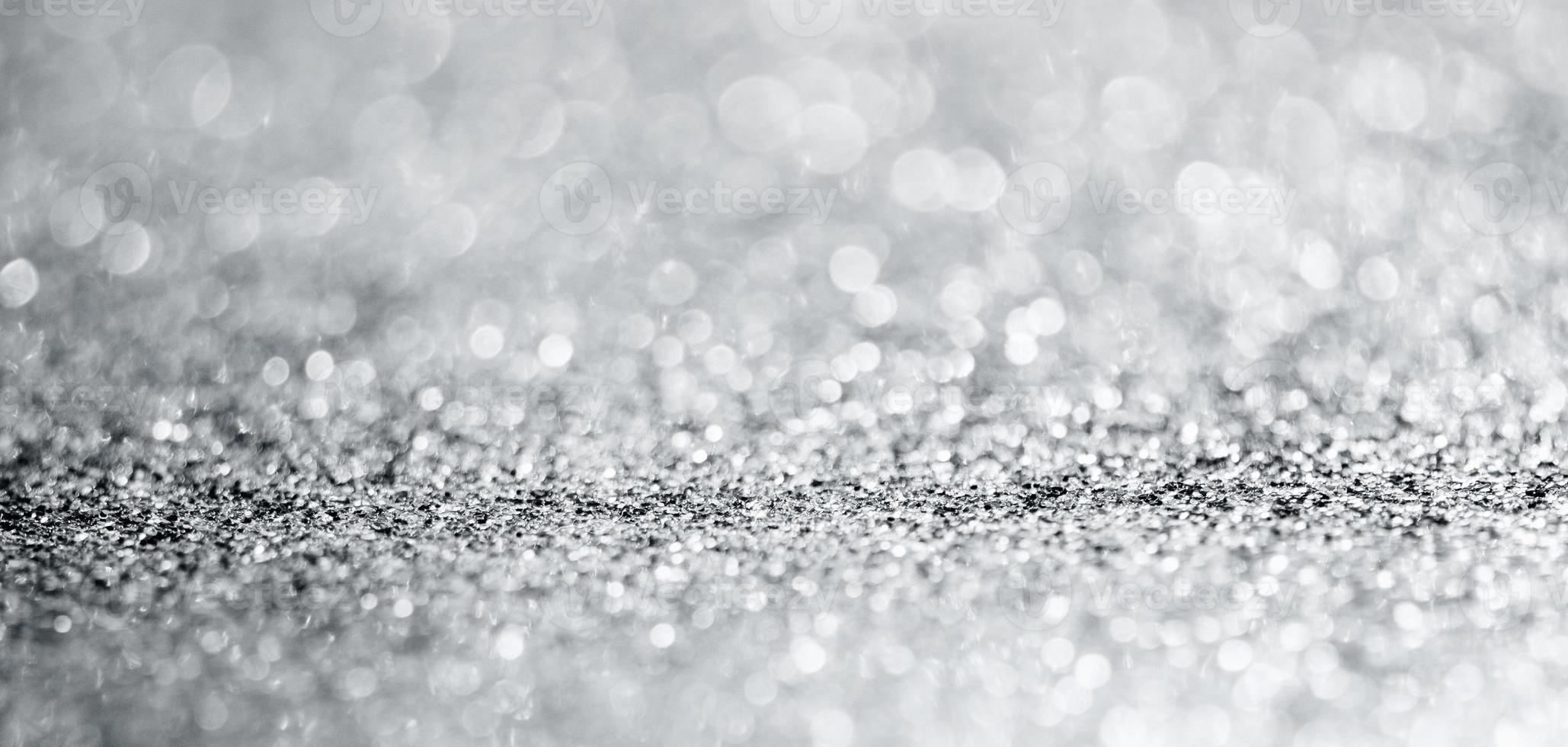 Abstract silver glitter sparkle texture with bokeh background photo