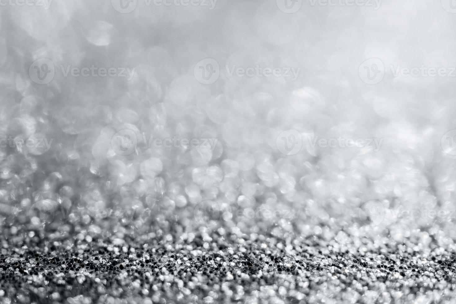 Abstract silver glitter sparkle texture with bokeh background photo