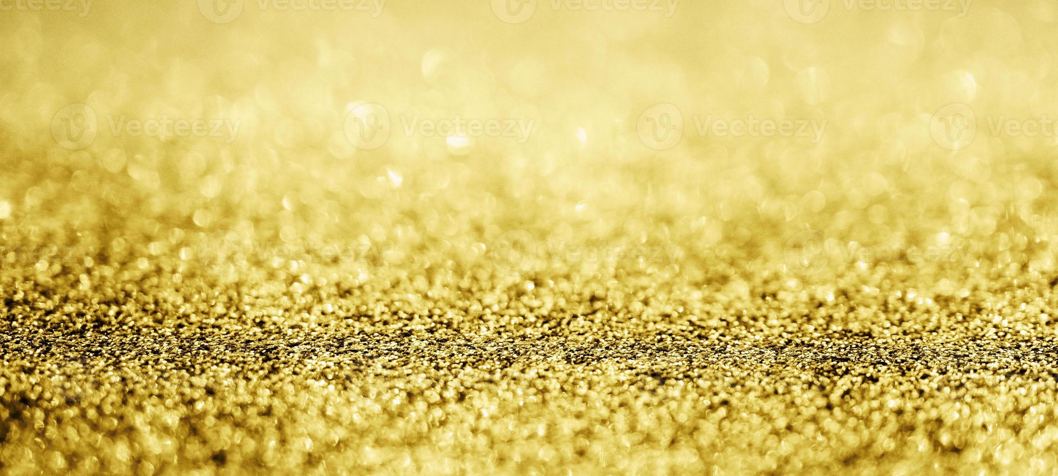 Abstract gold glitter sparkle with bokeh background photo