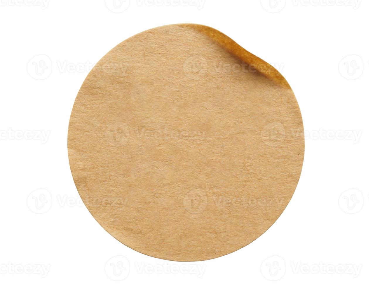 Brown round paper sticker label isolated on white background photo