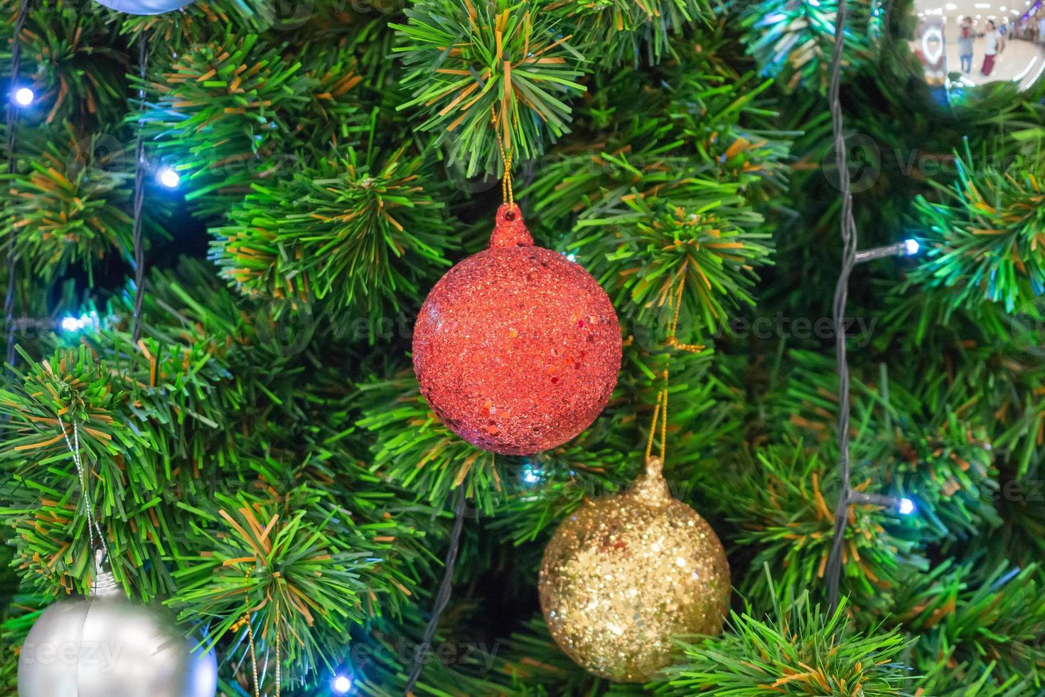 Decorated Christmas tree with red ball New Year holidays background photo