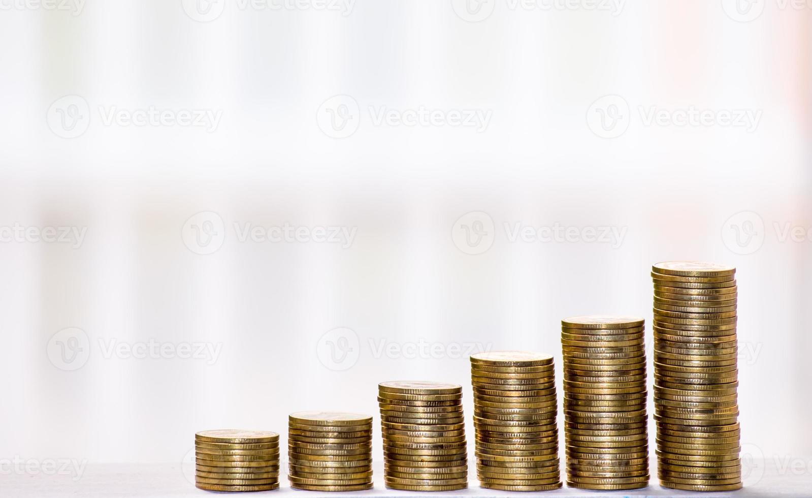 Business Finance and Money concept, Money coin stack growing graph with blur background,investment concept photo