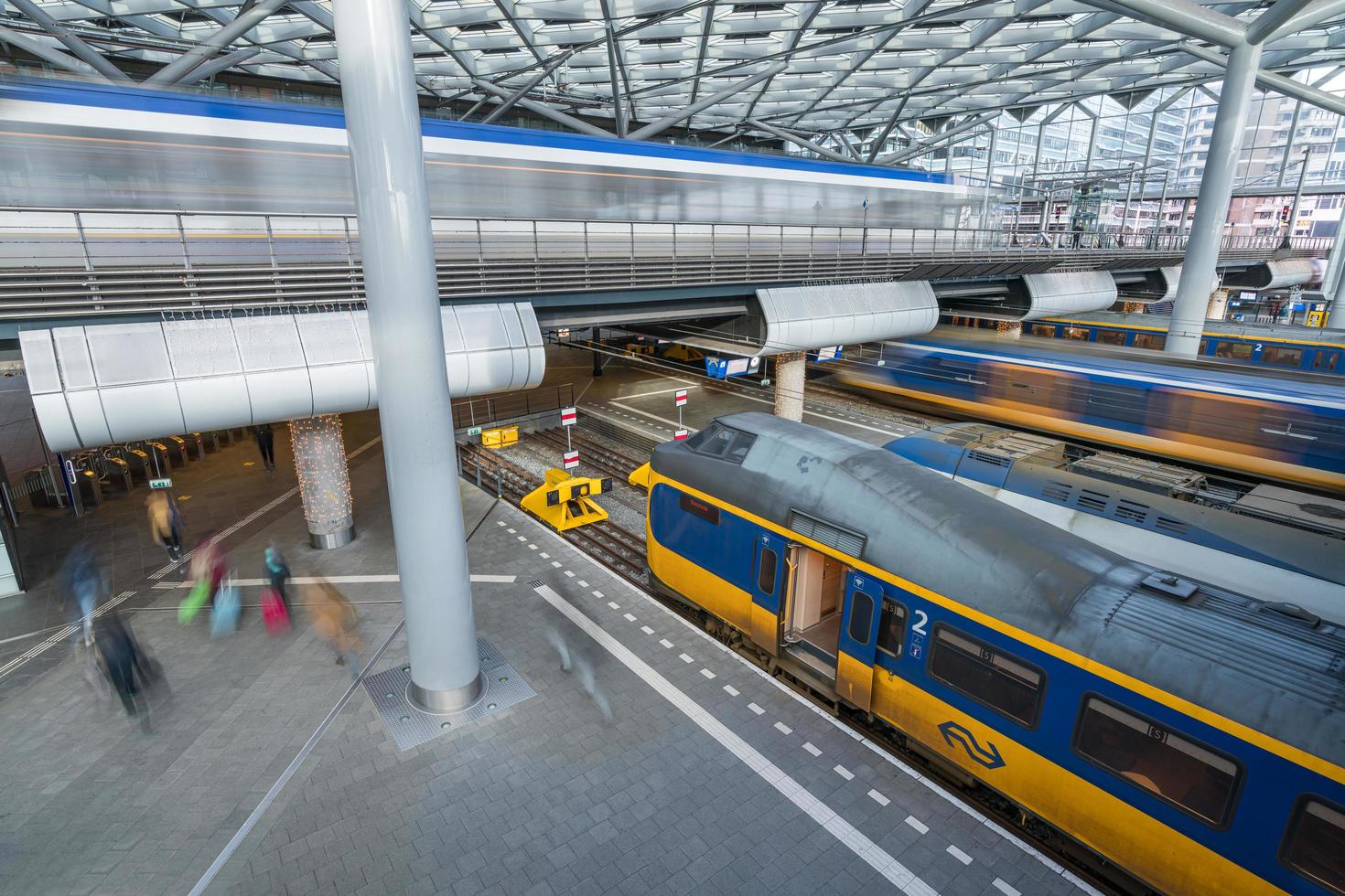 Den Haag, Netherlands - January 9 2022. Trains and trams arriving and departing Den Haag Central station in the Netherlands photo