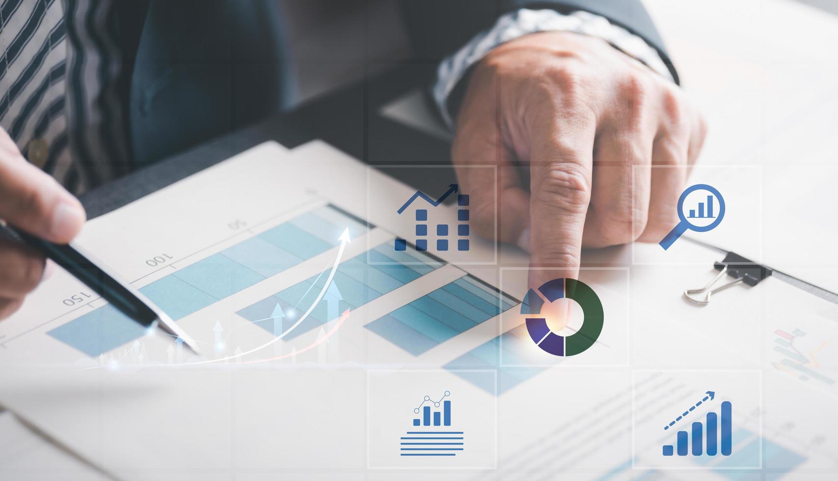Businessmen analyze market reports with statistics from charts and graphs, managing business and financial strategies, professional analysts view investment information, consulting and presentations. photo