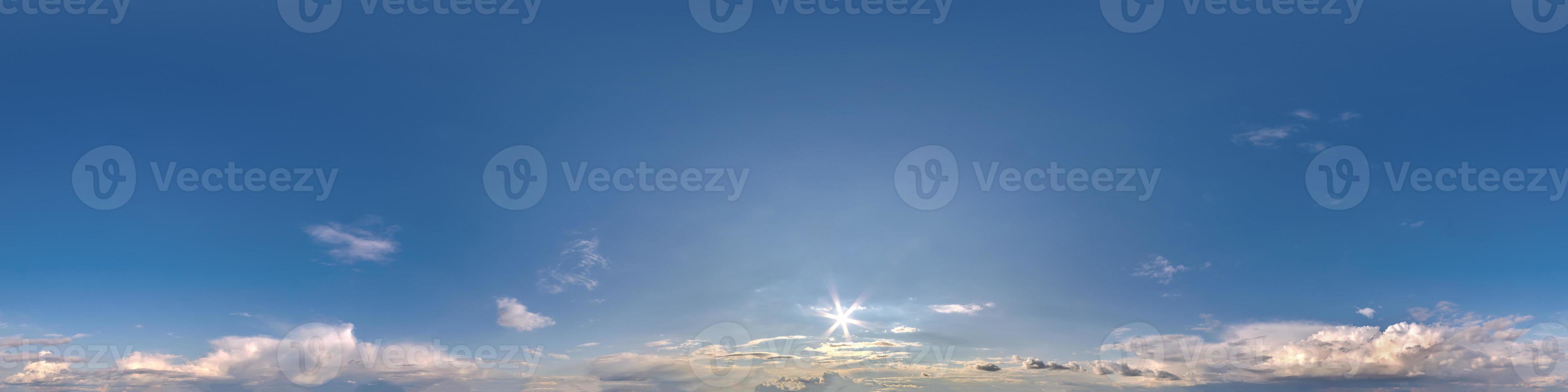 Seamless clear blue sky hdri panorama 360 degrees angle view with zenith and beautiful clouds for use in 3d graphics as sky replacement and sky dome or edit drone shot photo