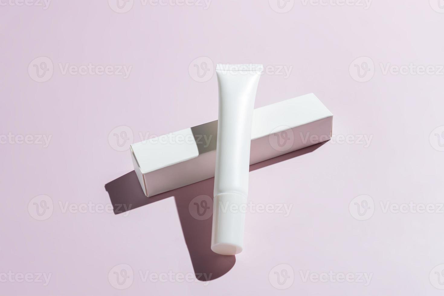 Eye base tube with cream, foundation, concealer. Women's hygiene cosmetic accessory for skincare. Unbranded package for your design photo