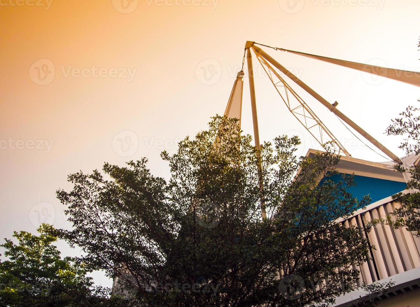 The modern building behide the trees photo