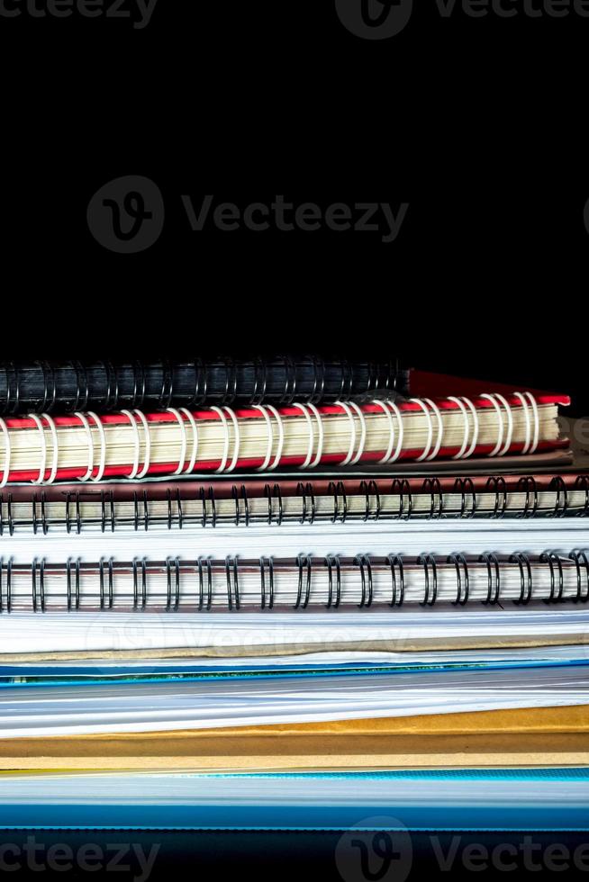 Stacked of office documents paper in the black background photo