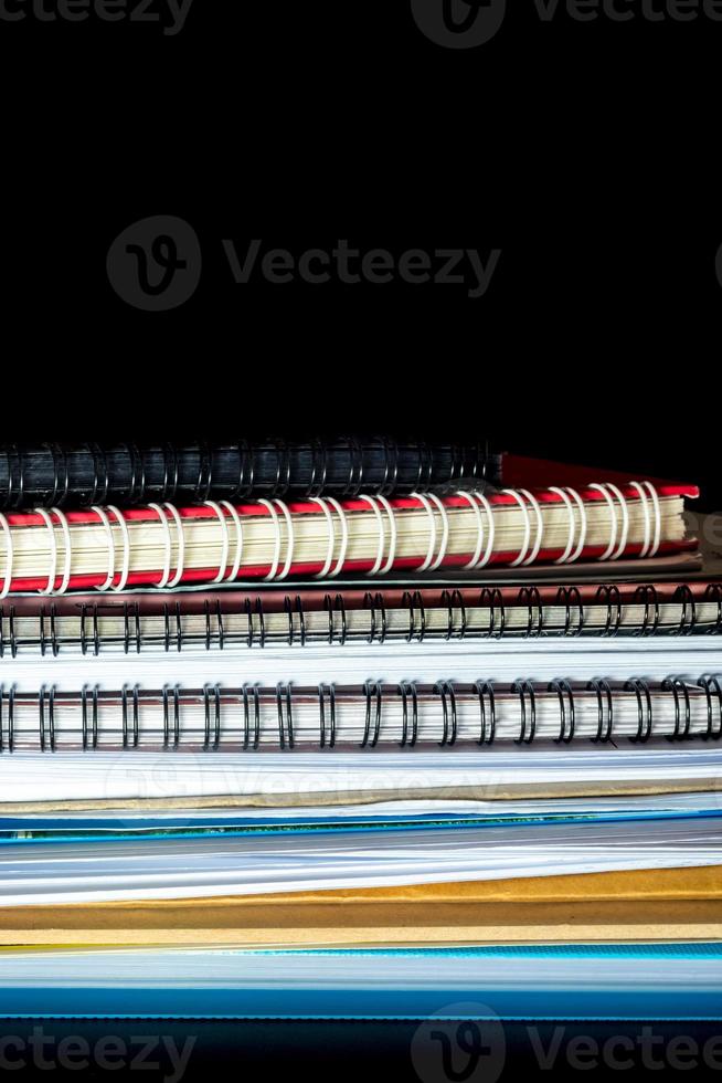 Stacked of office documents paper in the black background photo