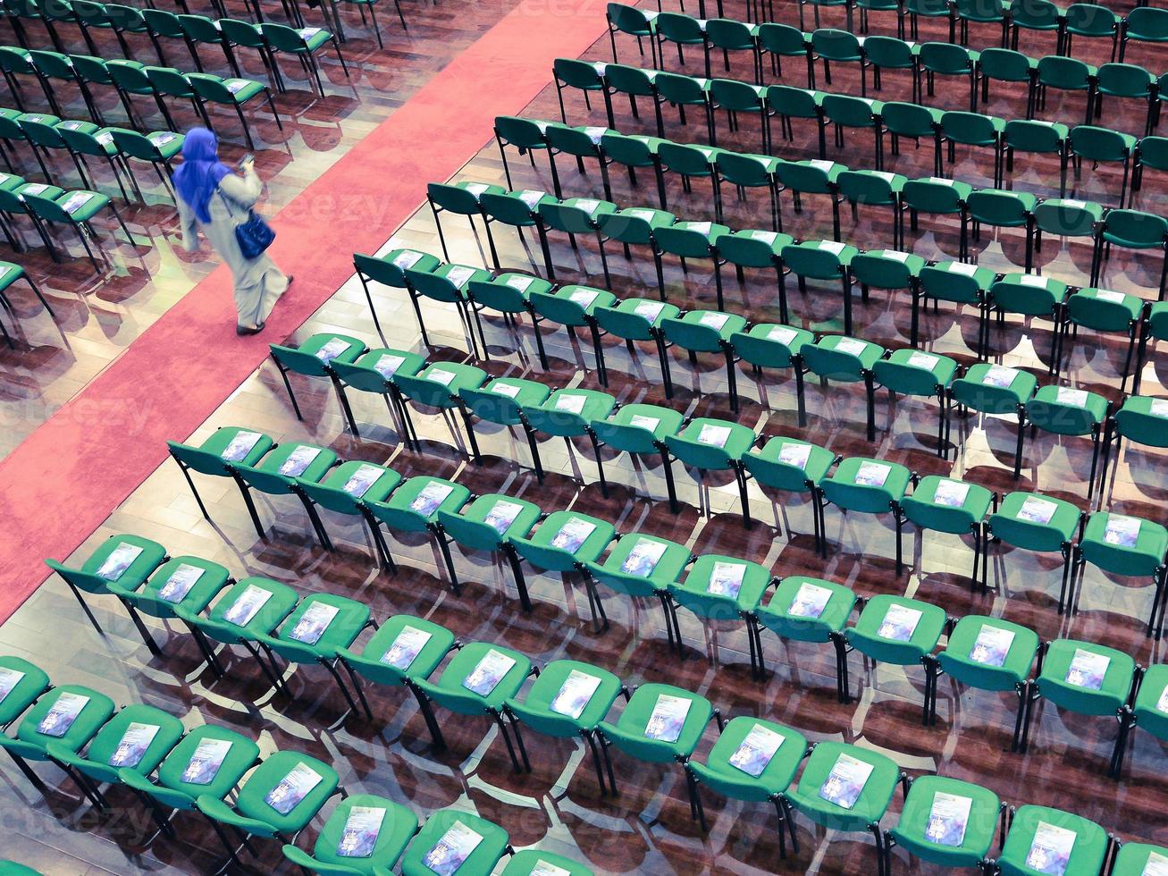 High angle view of chairs arranged in a row in a university convention hall photo